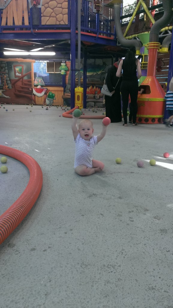 Baby with foam balls for the vacuum cleaner at six flags. | mommycrusader.com