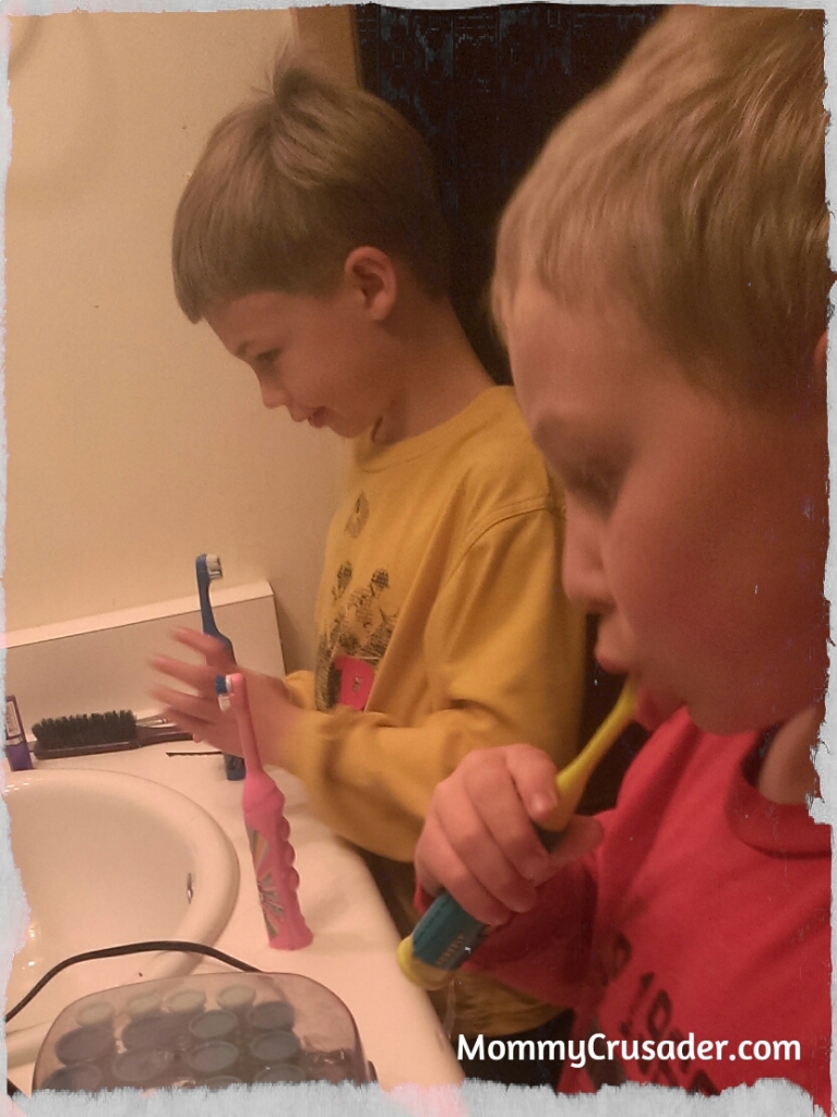 Second Grader and Kindergartner brushing their teeth. | MommyCrusader.com